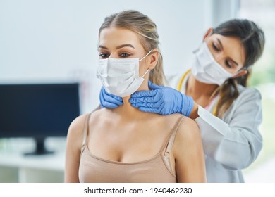 ENT Specialist In Mask Chcecking Up On Her Female Patient