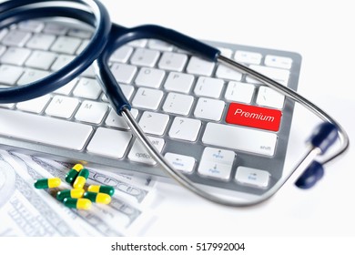 Enter Button Writing Premium on white keyboard. Selective focus with shallow depth of field apply.