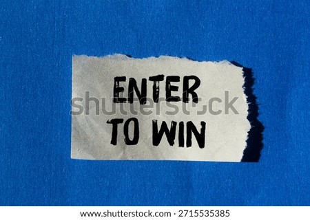 Enter to win message written on ripped torn paper background. Conceptual Enter to win symbol. Copy space.