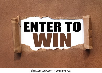 ENTER TO WIN. text inside torn brown paper. white sheet with black font.