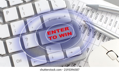 ENTER TO WIN text on a keyboard wirh chart and pencil - Shutterstock ID 2193396587