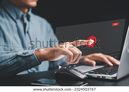 Enter the world of virtual streaming with a touch as a man's hand interacts with the screen, watching online videos, live concerts, and exploring the digital realm of technology.