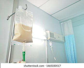 Enteral feeding bag on IV pole in patian room. - Shutterstock ID 1465030517