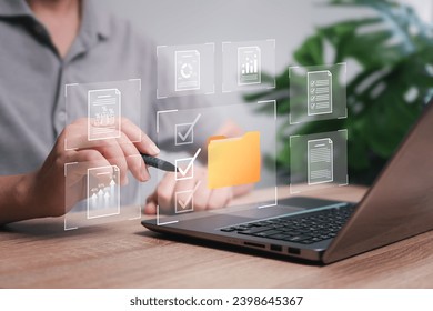 Enterprise Resource Planning, Document management, and business-grown data report concept. Businessman use laptops and select business data folders financial information business-grown graphs 