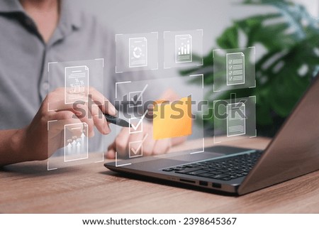 Enterprise Resource Planning, Document management, and business-grown data report concept. Businessman use laptops and select business data folders financial information business-grown graphs 