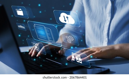  Enterprise resource planning(ERP) and management documentation concept. Businesswoman working on a laptop with virtual digital screen icons. - Shutterstock ID 2067864401