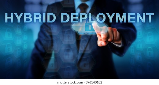 Enterprise strategist is pushing HYBRID DEPLOYMENT on a touch screen interface. Information technology concept and business strategy for moving IT into the cloud and keeping part of it on premise.