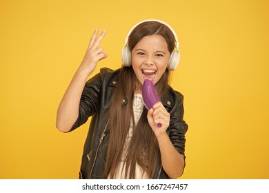 Entertain Herself By Being Creative. Musical Education. Singing Hairbrush Mic. Recording Studio. Beautiful Voice. Developing Voice. Voice Synthesis. Small Girl Listen Music Headphones. Hobby Concept.