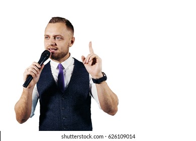 The Entertainer. Young Elegant Talking Man Holding Microphone, Isolated On White Background