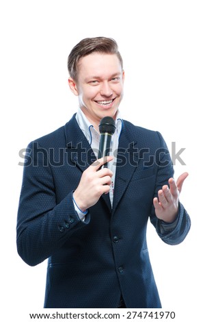 The entertainer. Young elegant talking man holding microphone, Isolated on white.