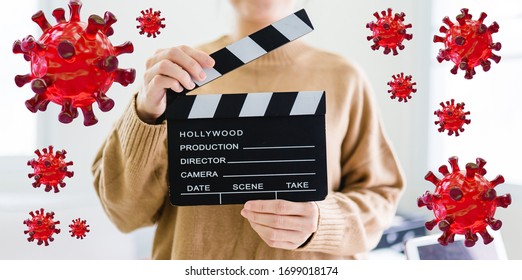 Entertainment Industry Crisis From Covid-19 Coronavirus Pandemic.Women Hands Holding Clapper Board For Making Video Cinema In Studio At Home.Movie Production Clapper Board Or Slate Film Concept.