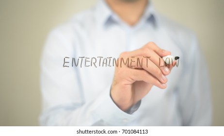 Entertainment Law, Man Writing On Transparent Screen