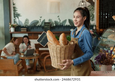 Enthusiastic baker in an apron displaying artisan bread, warm smile, inside a bakery with a welcoming vibe. happiness of opening a coffee shop in the morning small family business - Powered by Shutterstock