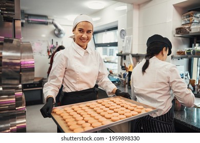 Enthusiastic confectioner doing her job with passion and dedication