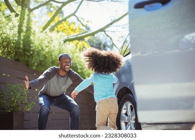 Enthusiastic father greeting daughter outside car - Powered by Shutterstock