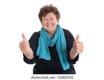 Enthusiastic and happy grandmother making thumbs up gesture with two fingers.