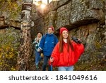 enthusiastic happy tourists on mountains or rocks together, sportive people explore the forest and nature, environment, hikinh trekking concept