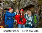 enthusiastic happy tourists on mountains or rocks together, sportive people explore the forest and nature, environment, hikinh trekking concept