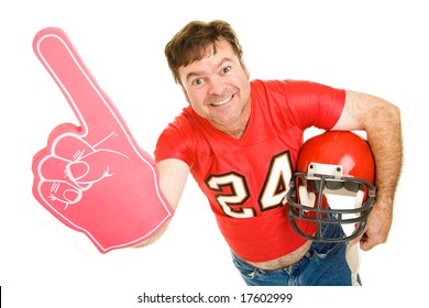 Enthusiastic Middle Aged Football Fan Wearing His Old High School Jersey And Holding A Helmet And A Foam Finger.  Isolated On White.