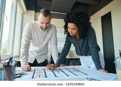 Enthusiastic Office Staff Discussing Working Draft Together