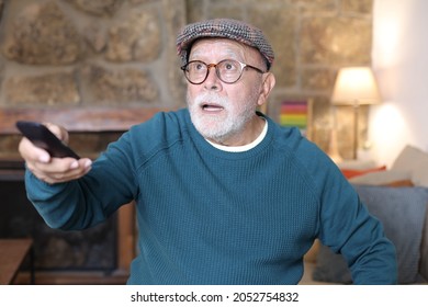 Enthusiastic Senior Man Watching The Tv