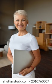 Enthusiastic Senior Woman Ready For New Day, In Mood To Start Work. Laptop For Remote Job From Home, Full Of Straight For Career Growth. Freelancer, Home Office, Work On Pension Concept