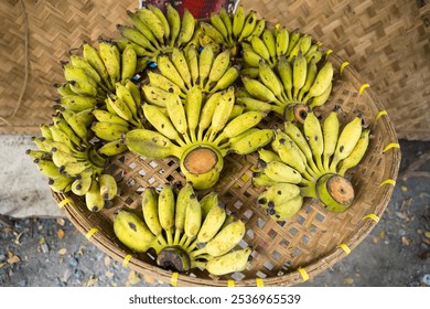 An enticing assortment of ripe Namwa bananas, reflecting the rich agricultural heritage of Thailand, perfect for health-conscious consumers seeking freshness. - Powered by Shutterstock