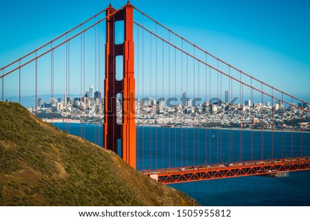 entire cityscape skyline through the Golden Gate Bridge perfect sunny afternoon in the San Francisco Bay Area overlooking the Northwest Passage and gorgeous views of Northern California