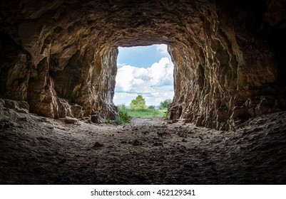 Entrance to an abandoned karst cave closeup - Shutterstock ID 452129341