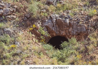Entrance to an abandoned mine on a hillside. Jerome, Arizona.