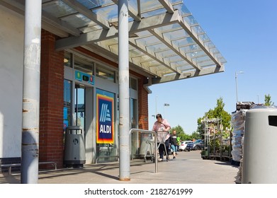 The Entrance To ALDI Supermarket With Woman Pushing Trolley. BOSTON Lincolnshire UK. June 2022