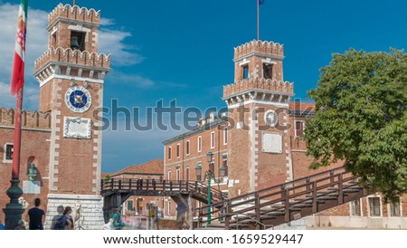 Entrance to the Arsenale timelapse, Venice, Veneto, Itlay and the Campo de l'Arsenale with the canal and Ponte de l'Arsenal o del Paradiso on a sunny day with few tourists