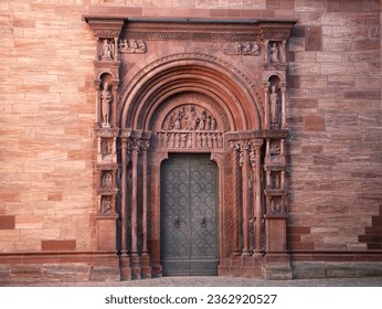 Entrance to Basel Minster, ornate gothic door with details.