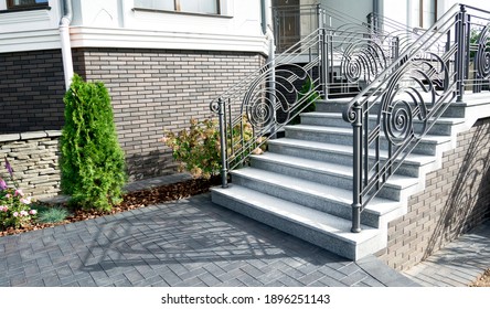 entrance to the building. Iron banister. Elements railing of a beautiful country house, Villa. staircase step with steel handrail.
