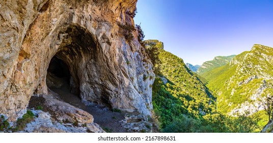 Entrance to a cave in the mountain. Mountain cave entrance