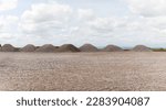 entrance construction site, driveway of building site. Pile of sand and Gravel for construction. limestone materials for construction industry.