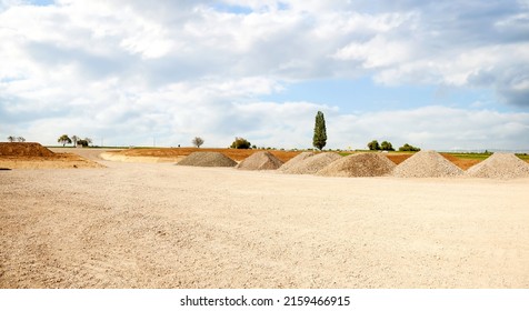 entrance construction site, driveway of building site. Pile of sand and Gravel for construction. limestone materials for construction industry. - Shutterstock ID 2159466915