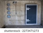 Entrance Door to a Bunker in a Sunny Day in Arzo, Ticino, Switzerland.