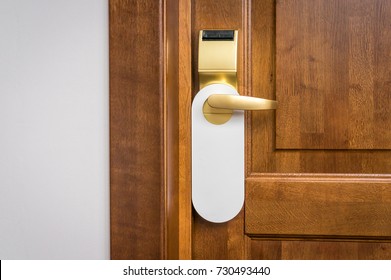 Entrance Door Of Hotel Room With Empty Sign Please Do Not Disturb