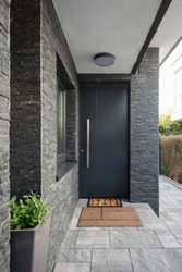 Entrance door into modern house, a bathroom with a sink and a toilet in it, an Architecture Photo by Ventura