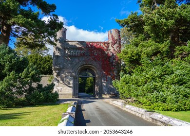 Entrance Gate House To Penrhyn Castle And Gardens (National Trust) With Beautiful Red Creeping Virginia (Parthenocissus Quinquefolia) Bangor Wales UK