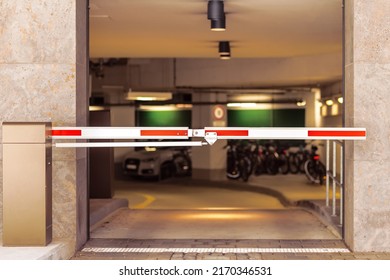 Entrance Gate to underground garage parking. Automobile parking inside. Automatic barrier in underground car parking.  - Shutterstock ID 2170346531