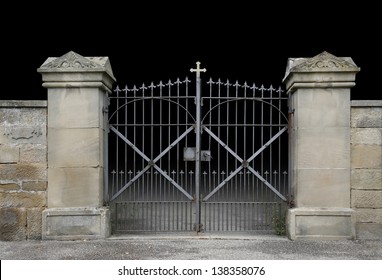 Entrance Of A Graveyard With A Closed Wrought-iron Gate In Dark Gradient Back