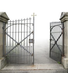 Entrance Of A Graveyard With A Open Wrought-iron Gate In Gradient Back And Clipping Path