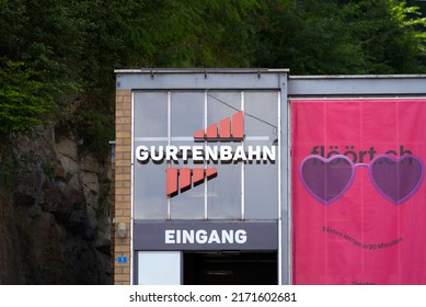 Entrance Of Gurten Cable Car With Pink Billboard Banner For Theater Play At Wabern, Canton Bern, On A Sunny Summer Day. Photo Taken June 16th, 2022, Wabern, Switzerland.