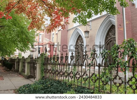 The entrance to a historic church building in Covington, Kentucky during the Fall season 