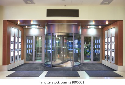 Entrance to hotel lobby with revolving door.