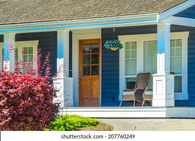 Entrance Of A House With Nicely Made, Organized Front Porch.