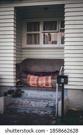 Entrance Of A Humble House With An Armchair.