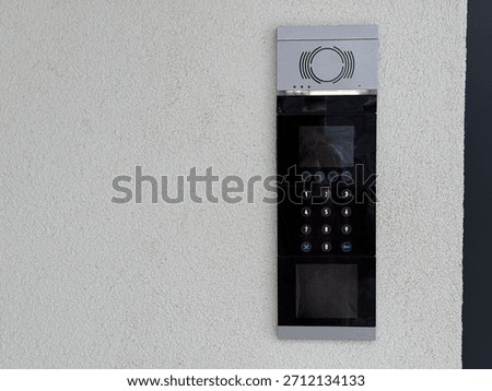 Entrance intercom with keypad. Security access, residential building control and modern communication technology. Copy space